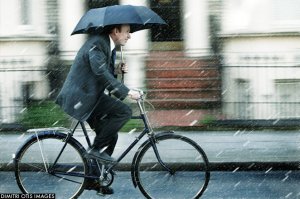 businessman-bicycle-rain-umbrella.jpg