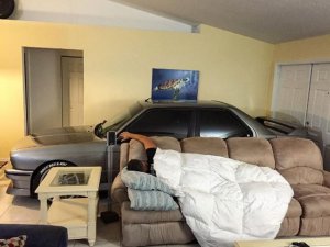 BMW-E30-M3-parked-inside-the-house-saved-from-Hurricane-Matthew-sleeping-next-to-the-car.jpg